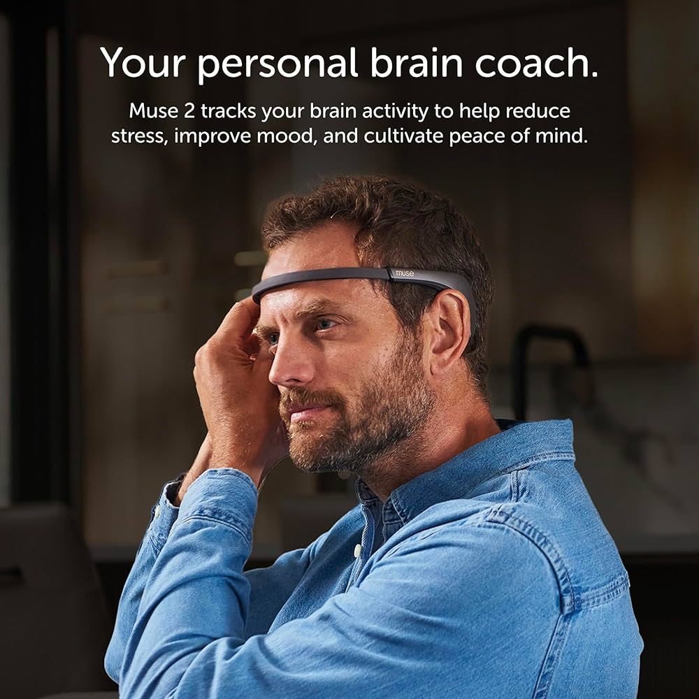 A woman wearing the Muse 2 headband at a sunlit kitchen table